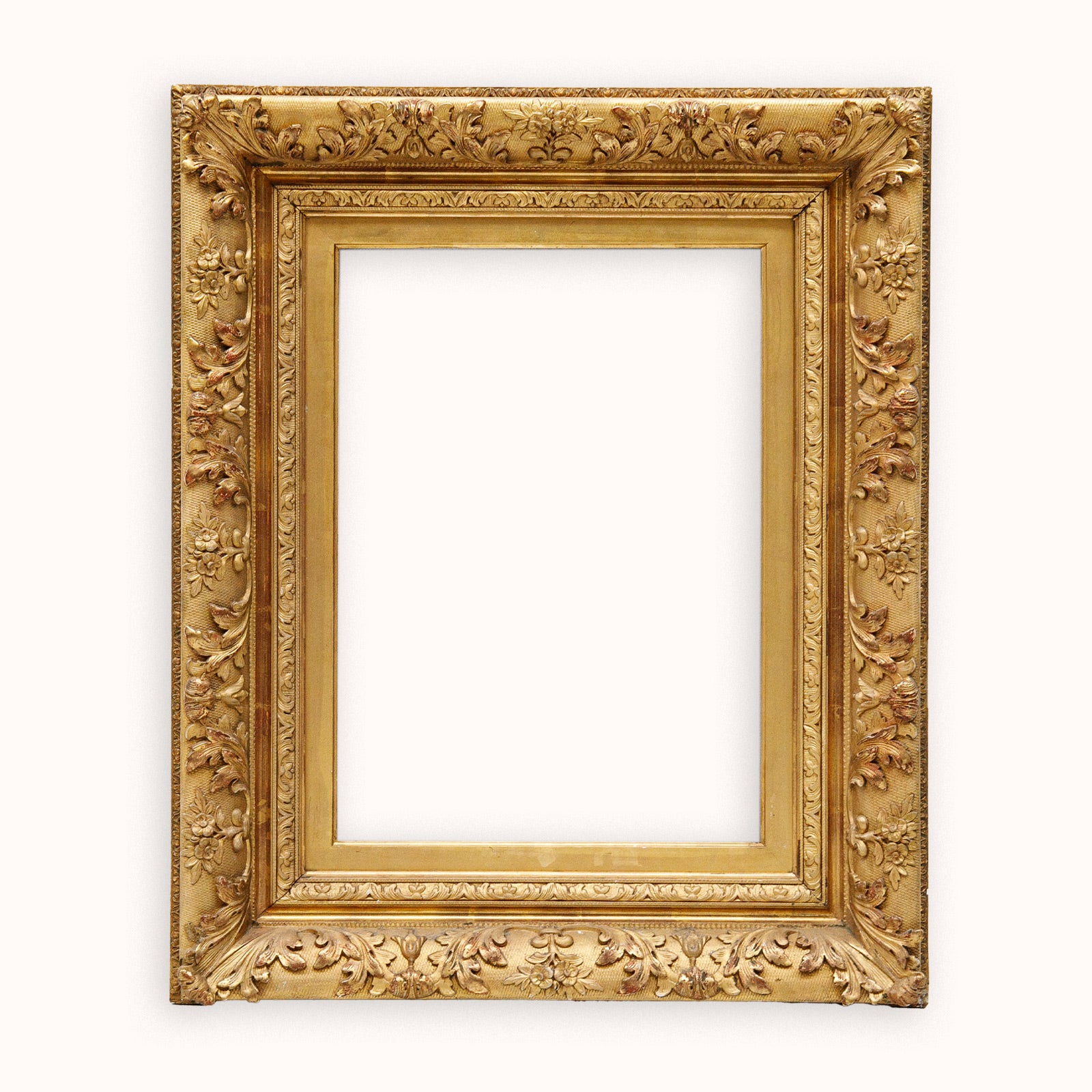 Decorative antique French gold frame on a white background available at Wildschut Antiques