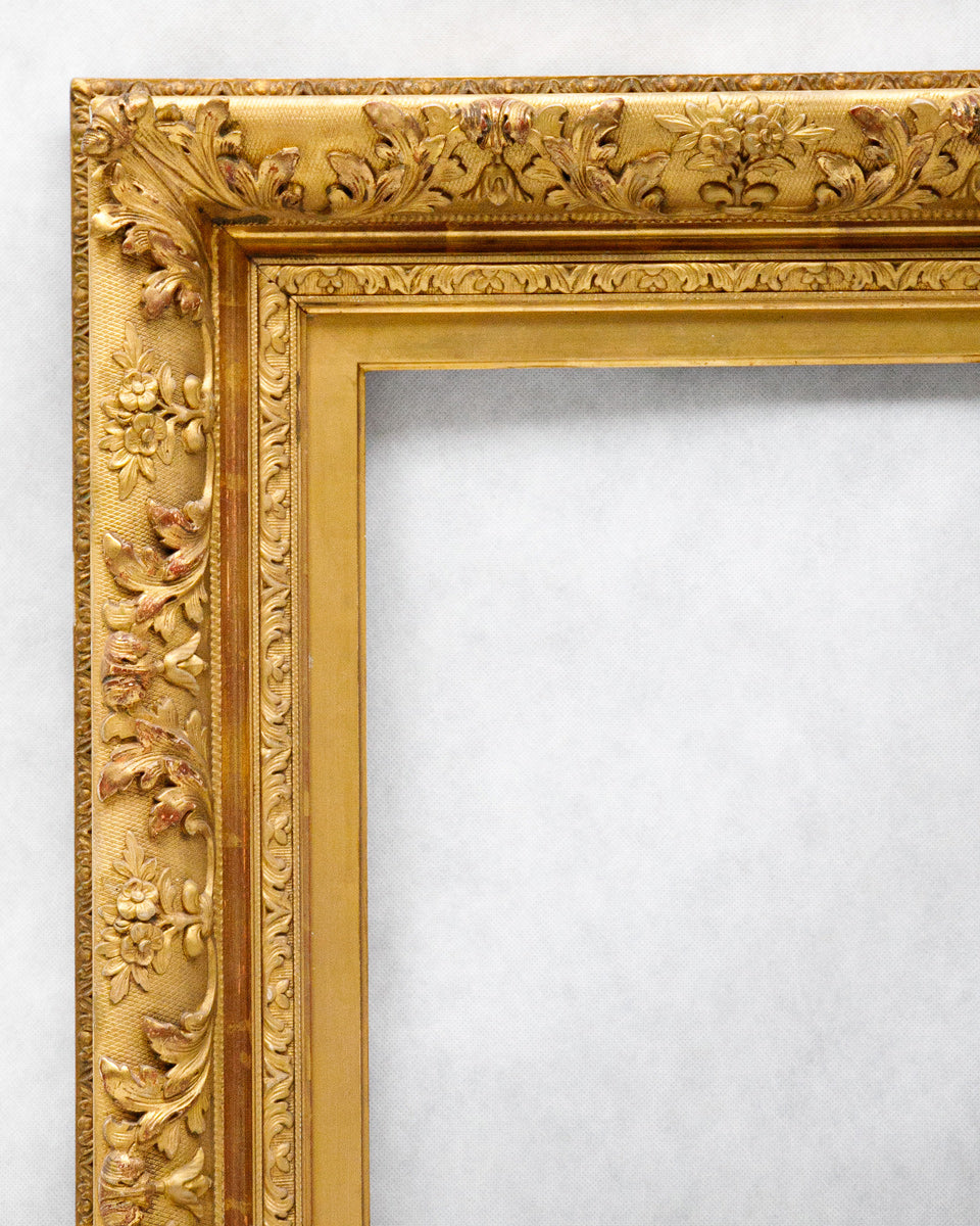 Close-up of a old ornate picture frame on a white background
