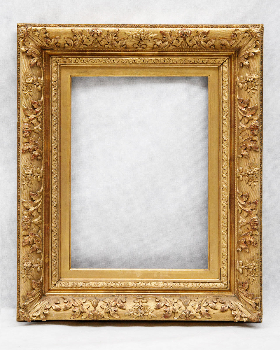 Decorative antique French baroque gold frame on a white background