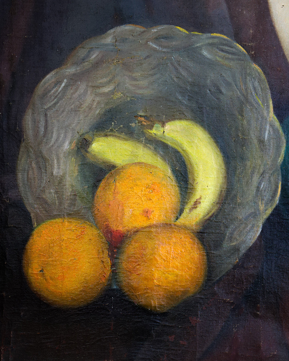 Close-up of a decorative early 20th-century still life oil painting depicting a charming arrangement of oranges and bananas in a basket