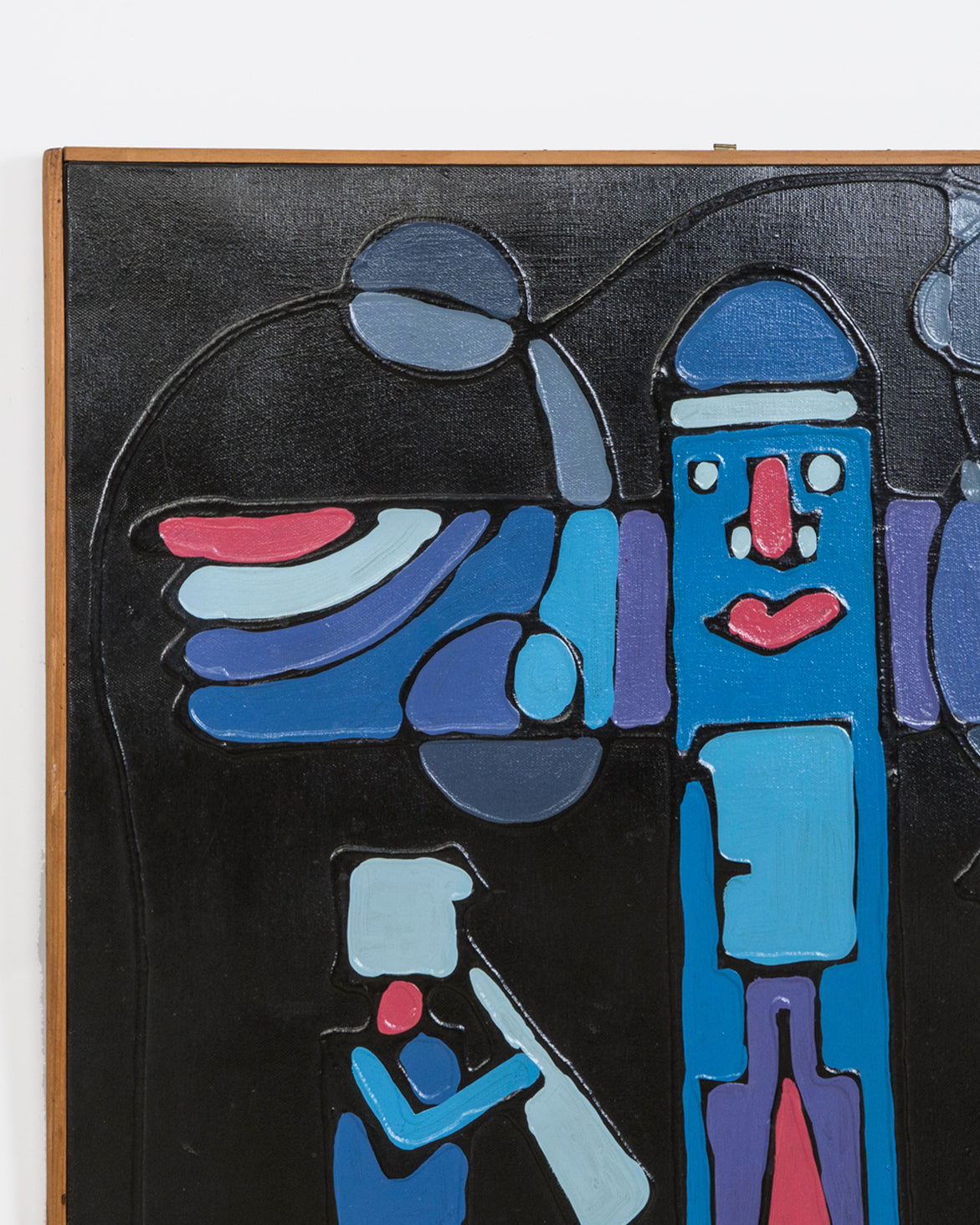 Close-up of an abstract 1970s Italian artwork featuring a central totem-like figure with a face and wing shapes, surrounded by blue, red, and black forms on a dark background—Signed by F. (Francesco) Magli, dated 1977 and available at Wildschut Antiques