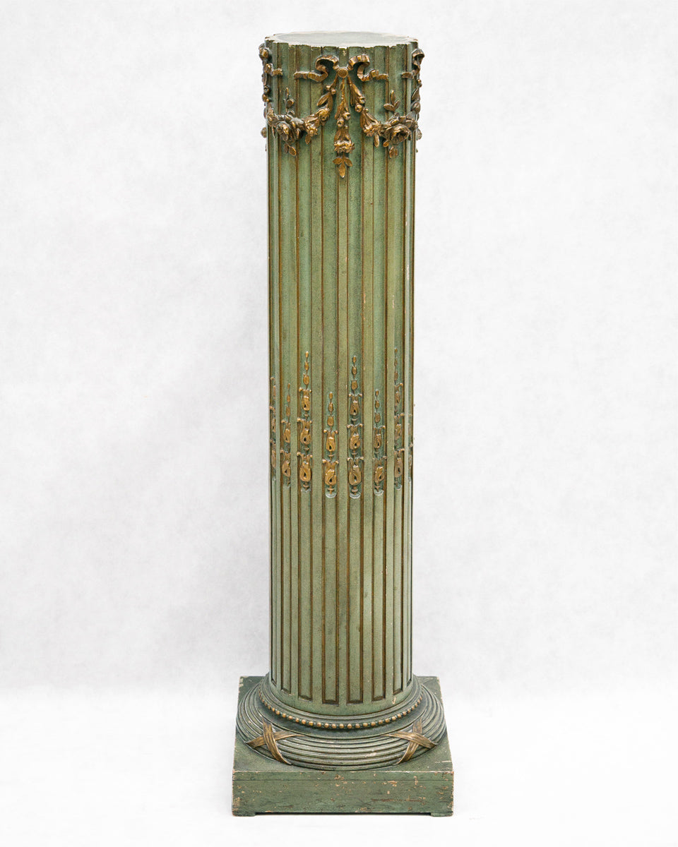Decorative antique French olive green pedestal with classical design on a white background available at Wildschut Antiques