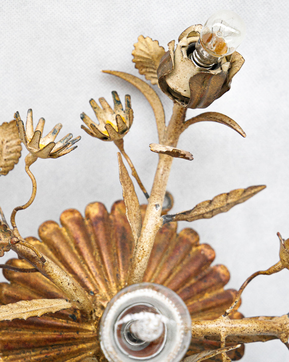 Close-up of a decorative tole wall sconce or ceiling light with floral designs on a white background available at Wildschut Antiques