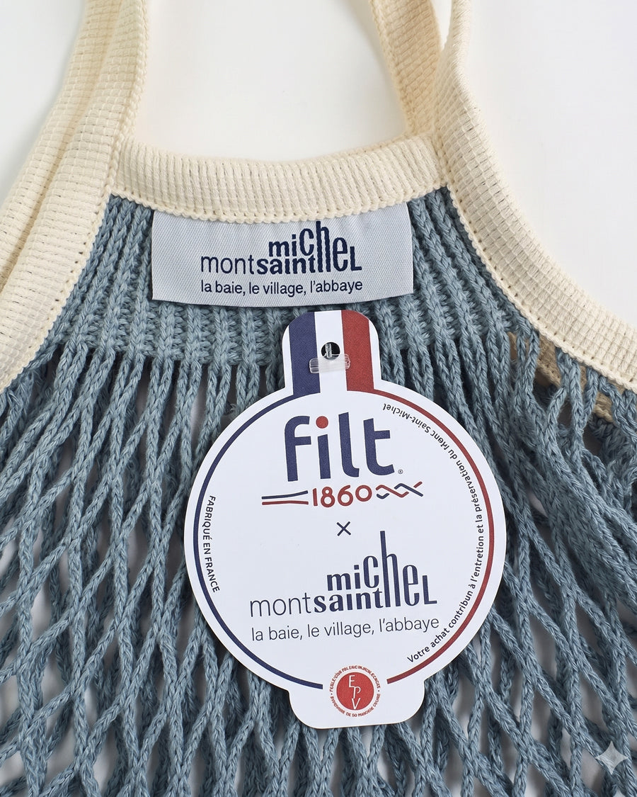Filt 1860 and Mont St. Michel label on a light blue mesh bag.