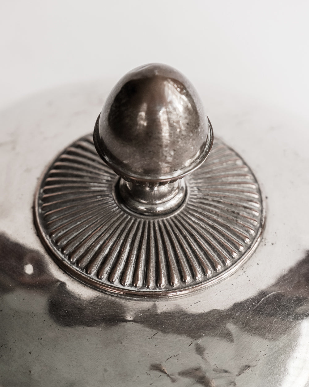 Close-up of a decorative antique silver-plated food dome, offered by Wildschut Antiques.