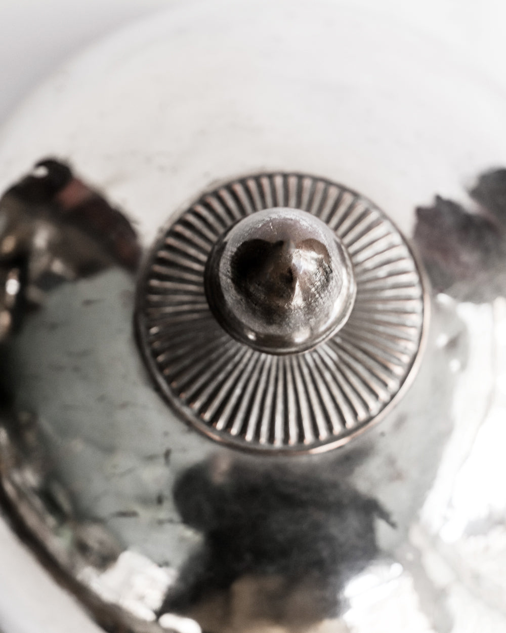 Close-up of a decorative antique silver-plated food dome, offered by Wildschut Antiques.