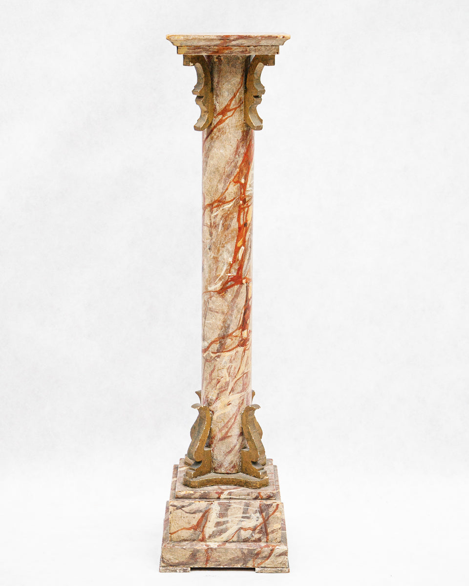 Decorative faux marble wooden column or pedestal with intricate design on a white background