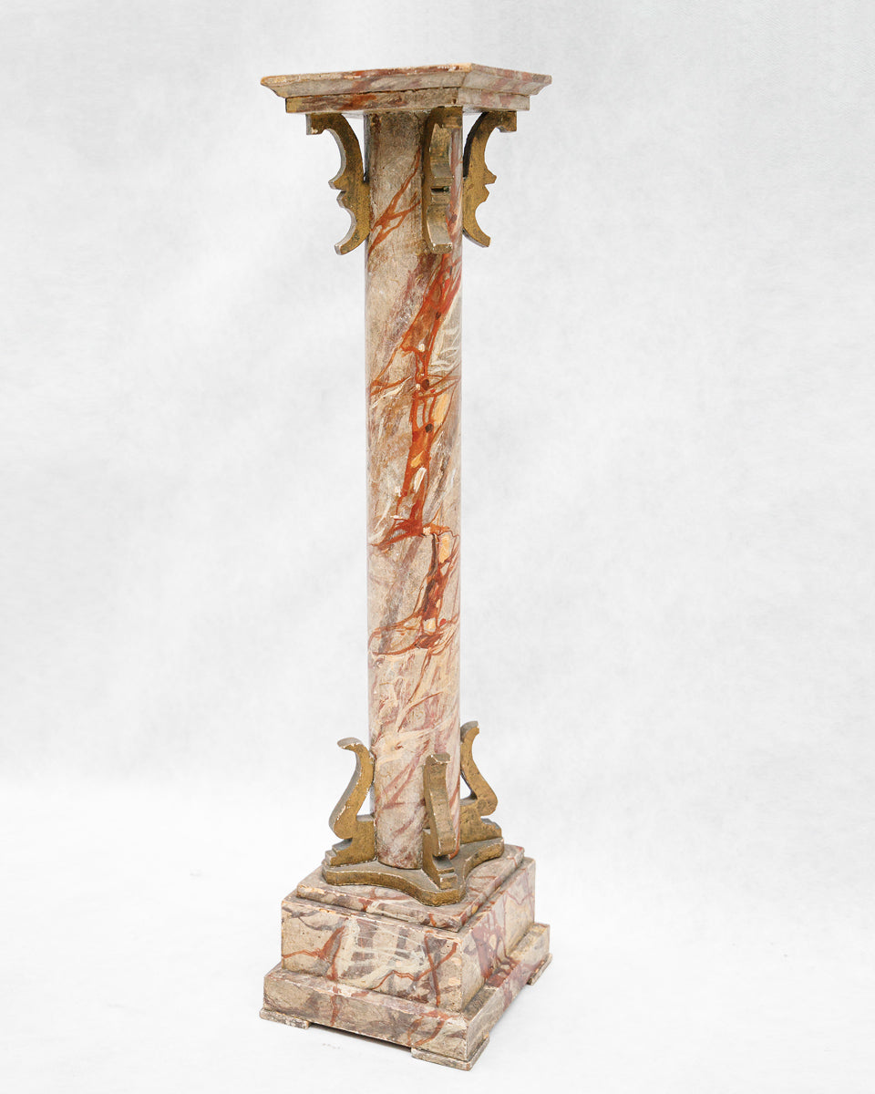 Decorative faux marble wooden column or pedestal with intricate design on a white background