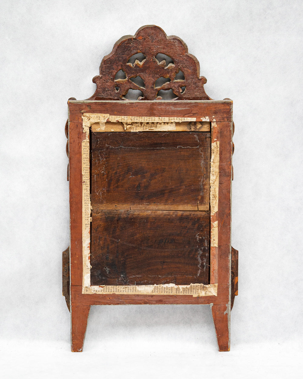 Backside of a decorative antique gold gilt wooden marriage mirror with intricate flower carvings on a white background, available via Wildschut Antiques