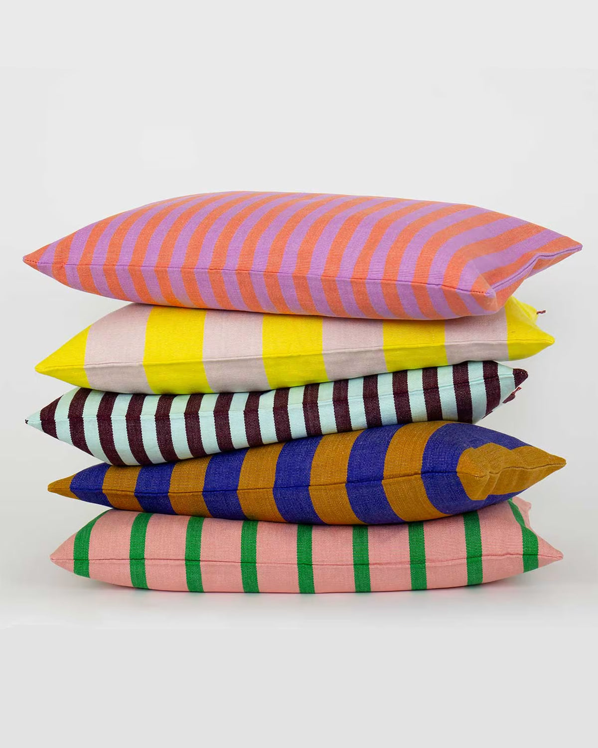 A bunch of colorful striped pillows available at Wildschut Antiques