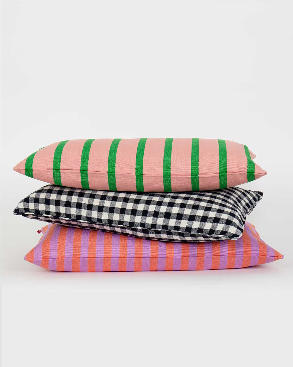 A bunch of colorful striped pillows available at Wildschut Antiques