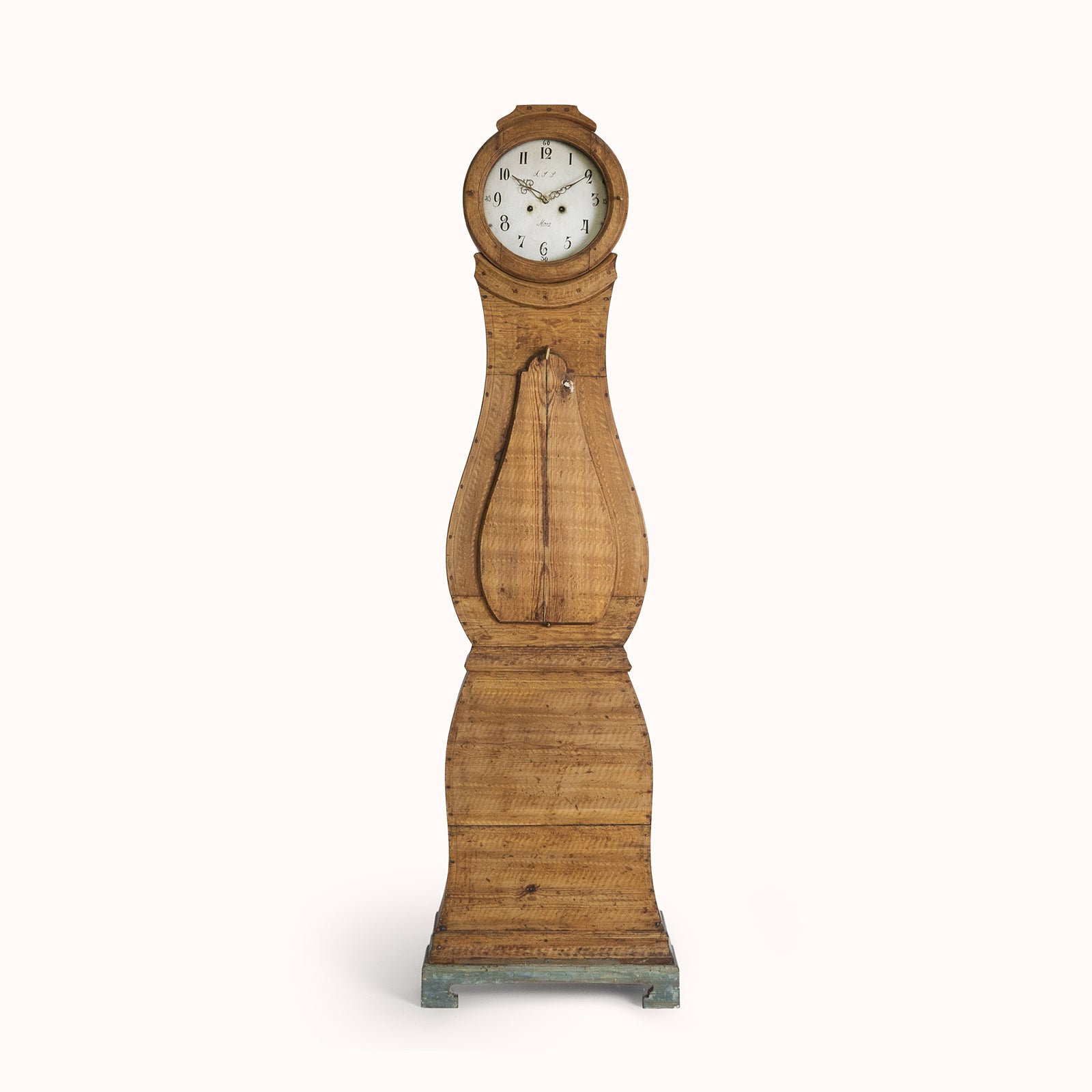 Antique Swedish mora clock with a natural finish, wide belly body, and a numeral face, available at Wildschut Antiques
