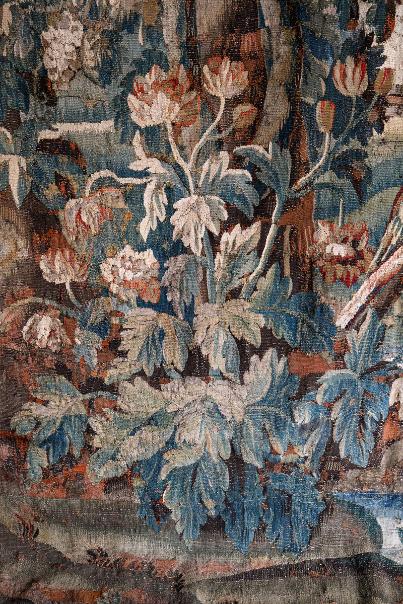 Close-up of a 18th-century floral tapestry with intricate details