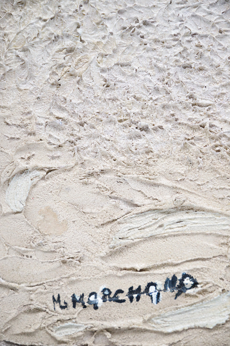 Textured beige surface with a signature in black