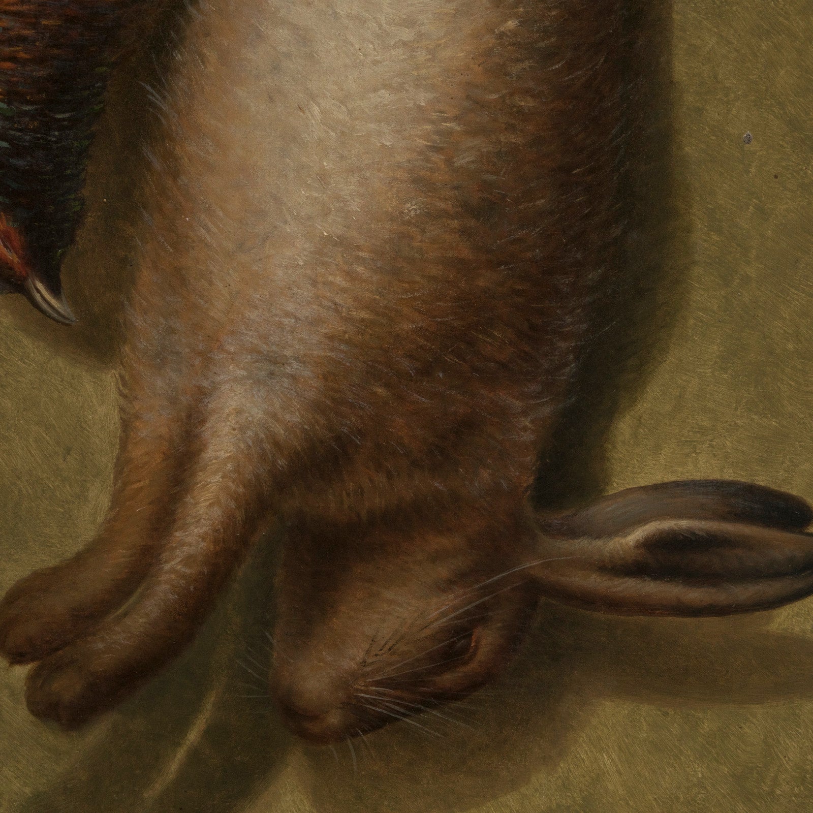 Close-up of an antique French oil painting depicting a hunting still life scene with a rabbit and birds