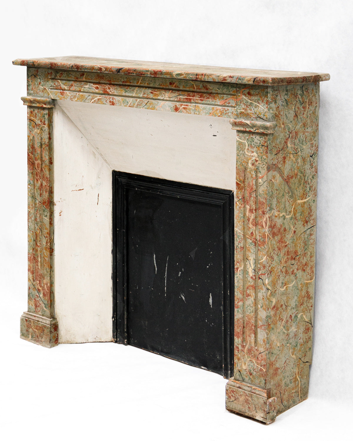 19th century antique French fake painted marble fireplace with a colorful pattern on a white background, available at Wildschut Antiques