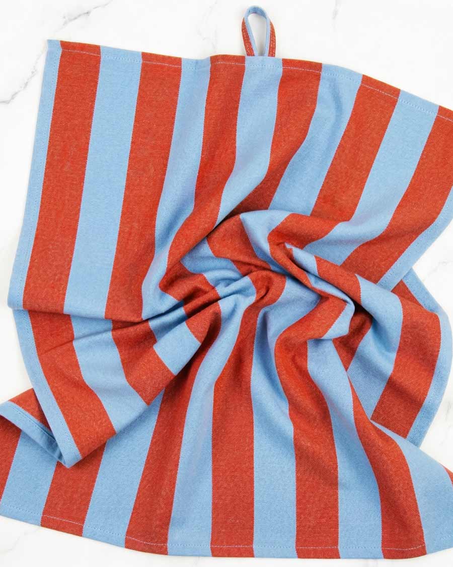 Red and blue striped towel on a white background, available via Wildschut Antiques.