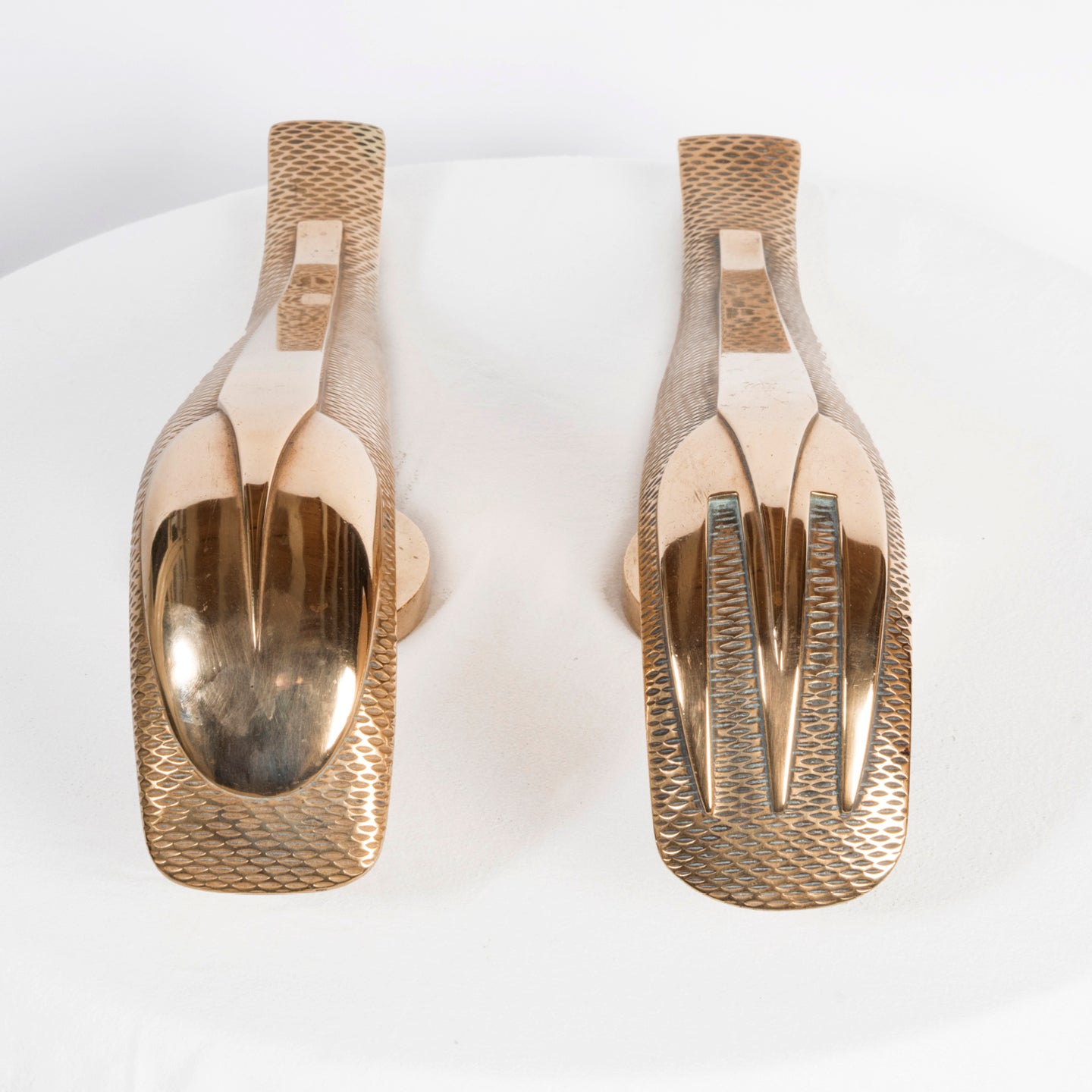 Front view of a unique and rare pair of gold-colored Art Deco style door pulls with a spoon and fork design, made of shiny brass