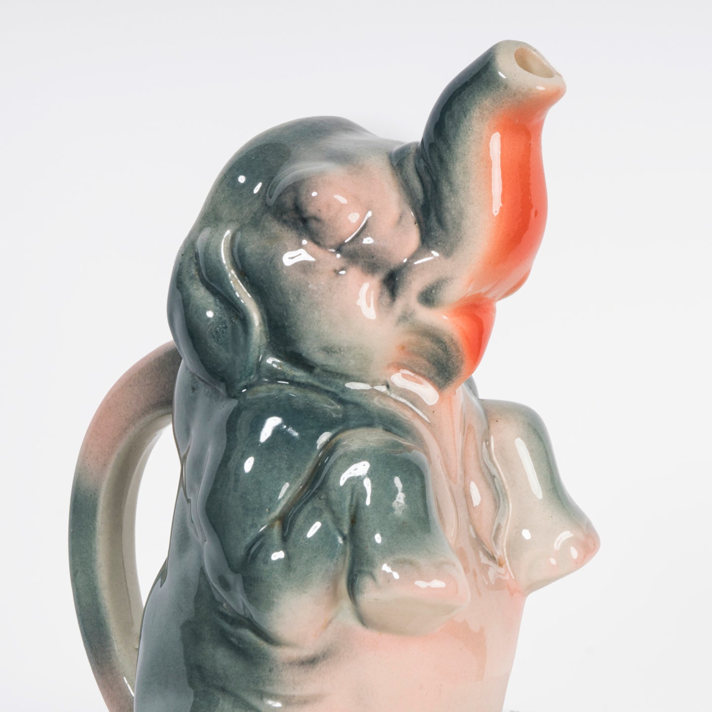 Close-up of a vintage French majolica pitcher designed as a decorative elephant.