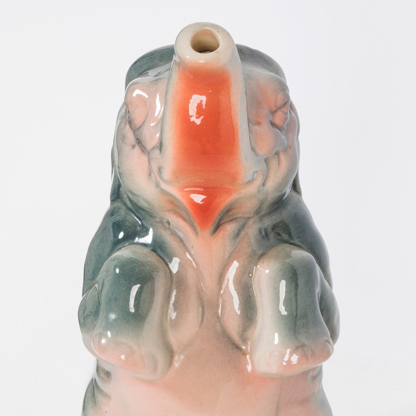 Close-up of a vintage French majolica pitcher designed as a decorative elephant.