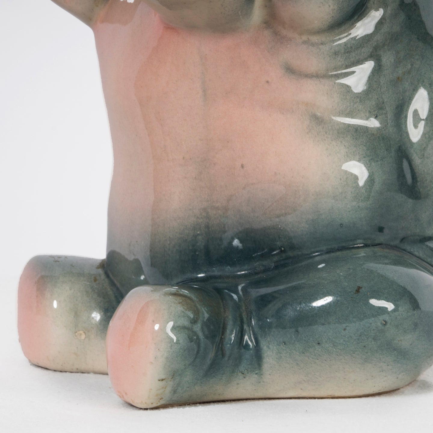 Close-up of a vintage French majolica pitcher designed as a decorative elephant.