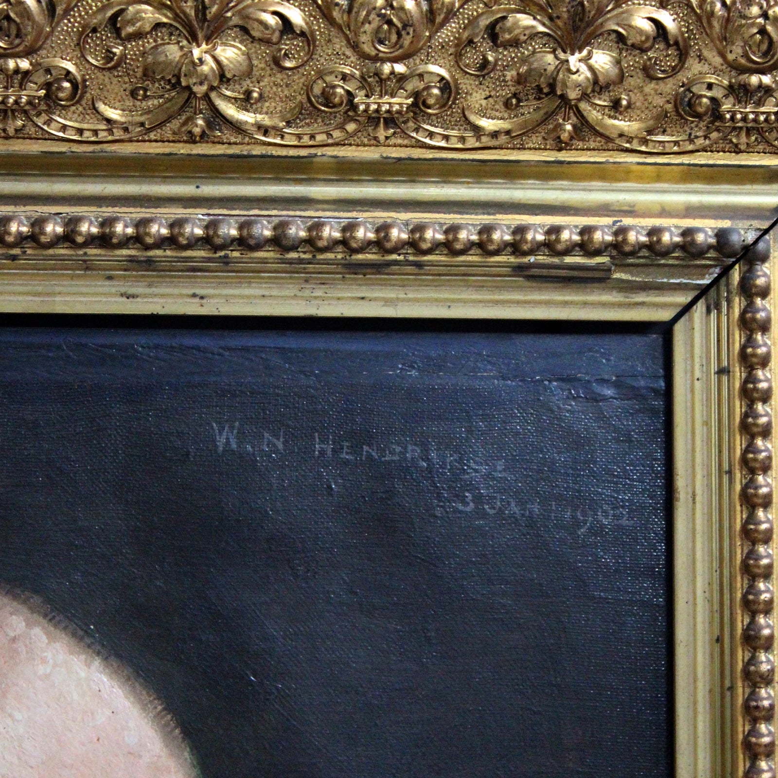 Close-up of an antique oil portrait of a gentleman, in a giltwood frame, signed by W.N. Hendrikse and dated 1902