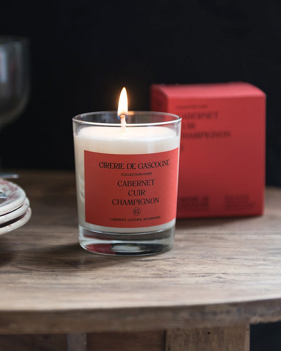 A Cabernet Leather Mushrooms scented candle by Cirerie de Gascogne, with text indicating it is part of the Winter Collection, available at Wildschut Antiques
