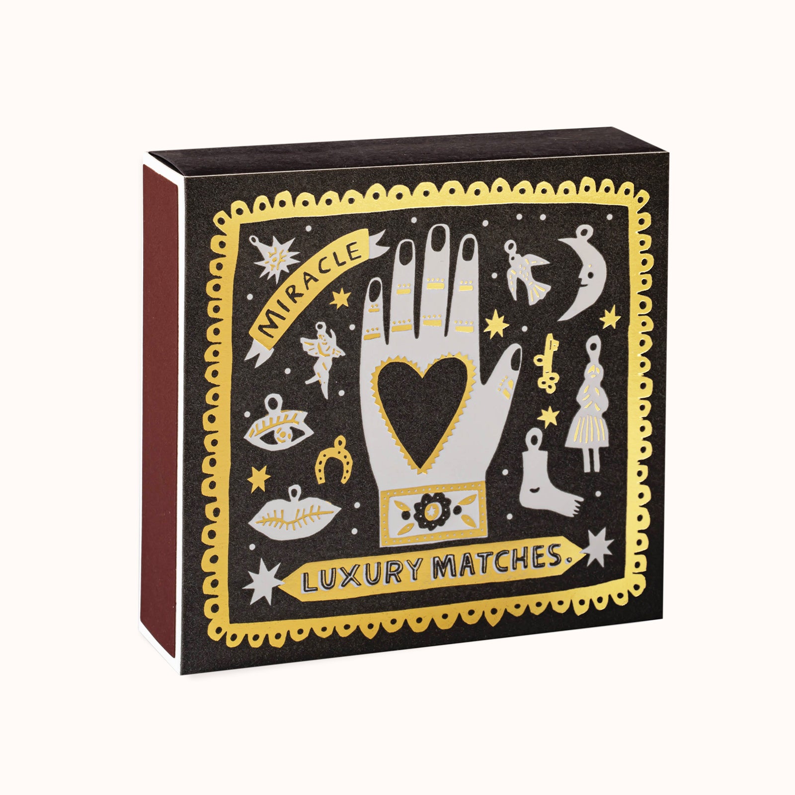 Box of luxury matches with a decorative black and gold design.