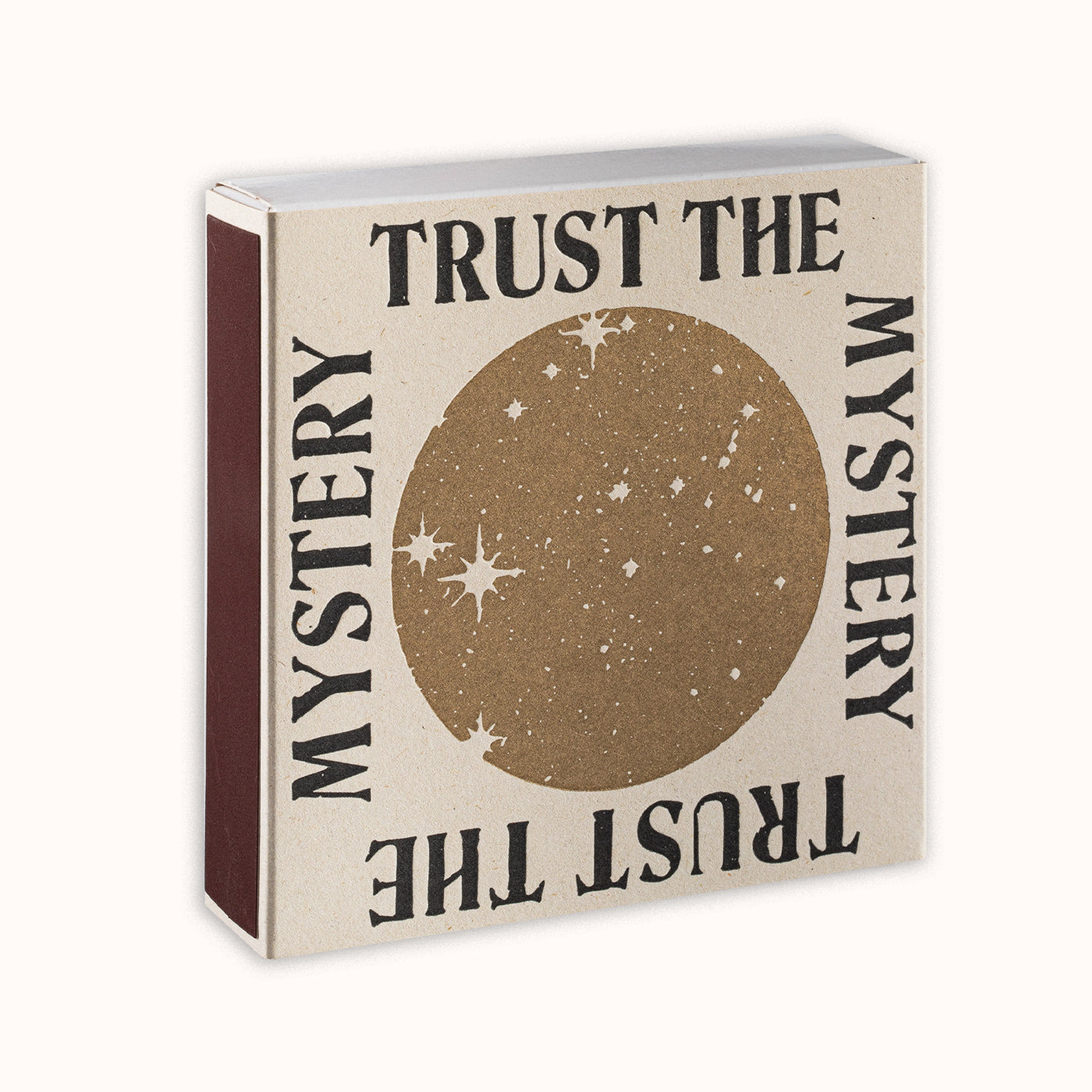 Decorative box with 'Trust the Mystery' text and star design on a beige background. By Archivist Gallery, available at Wildschut Antiques.