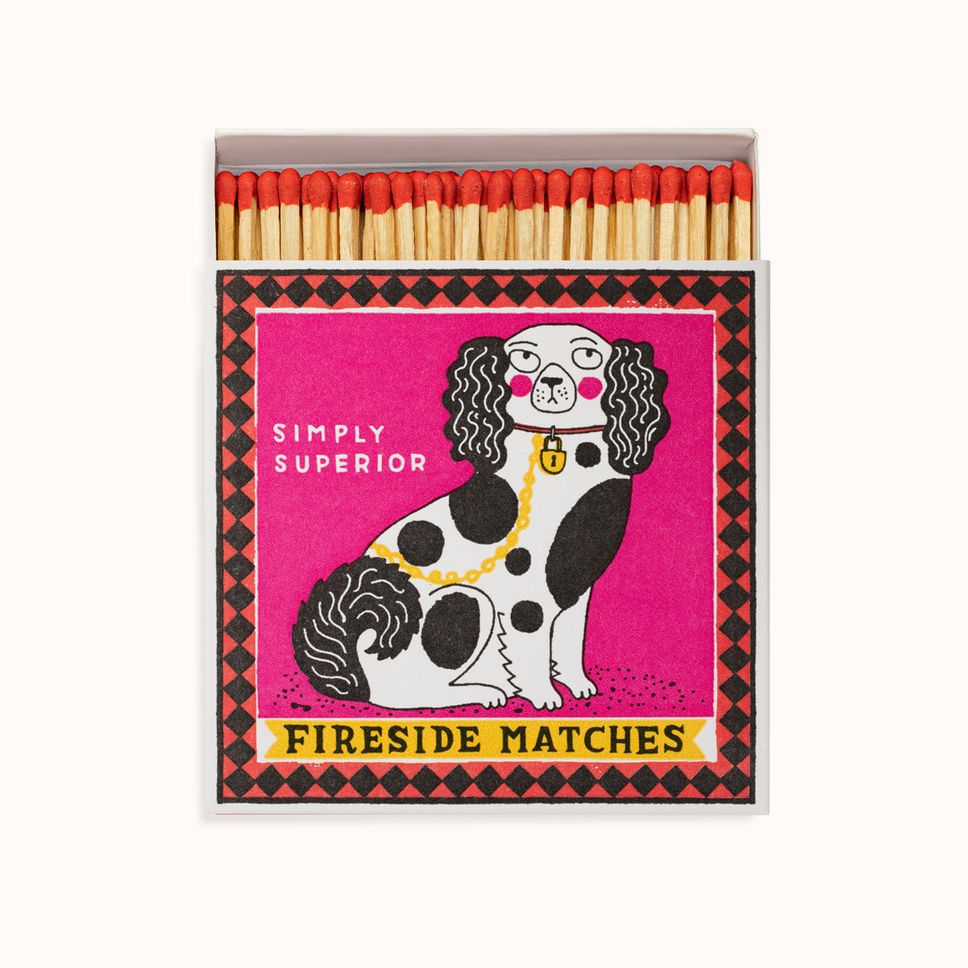 Matchbox with a dog illustration and 'Simply Superior Fireside Matches' text on a pink background. A design by the Archivist Gallery and available at Wildschut Antiques.