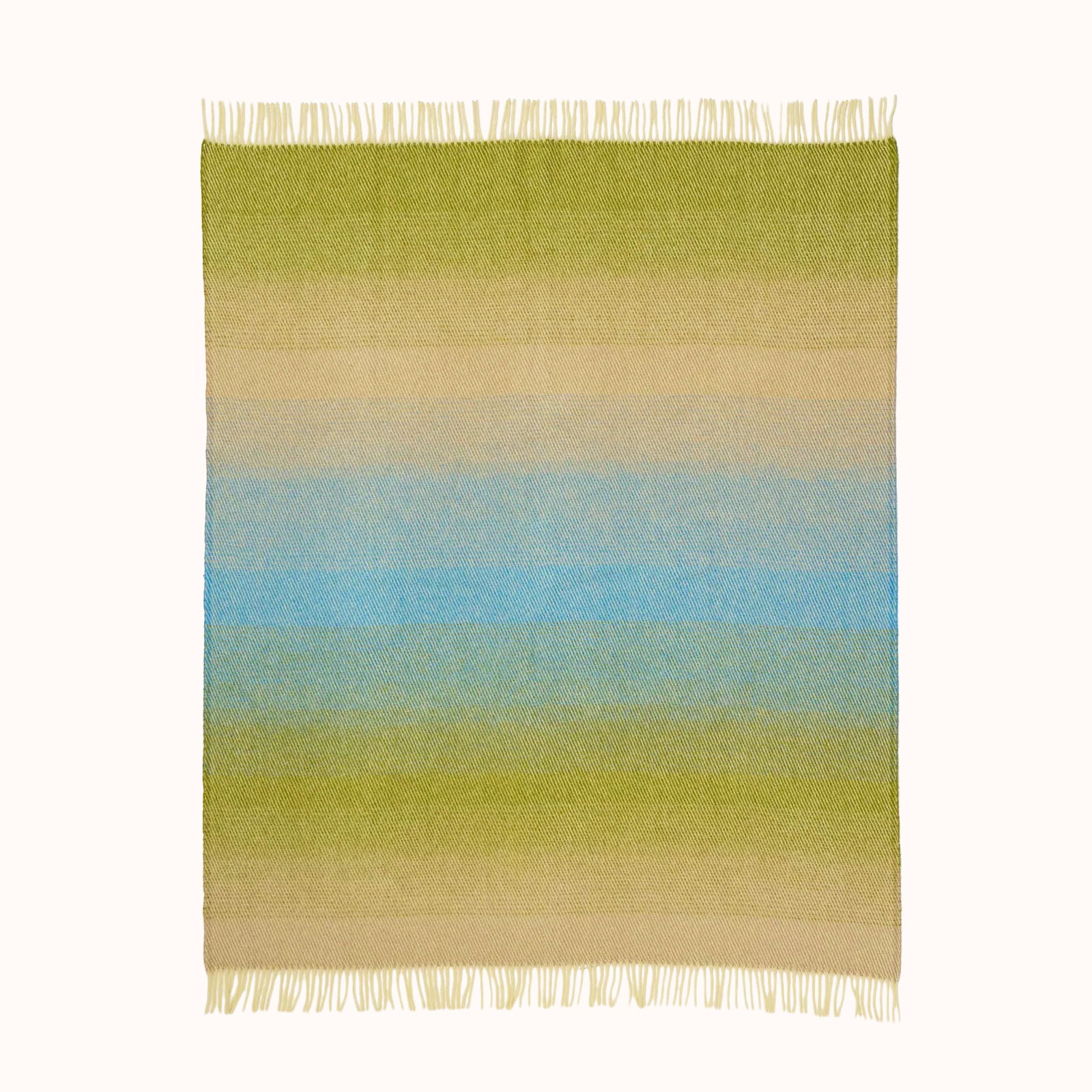 Gradient striped wool blanket throw with green, blue, and beige colors on a white background