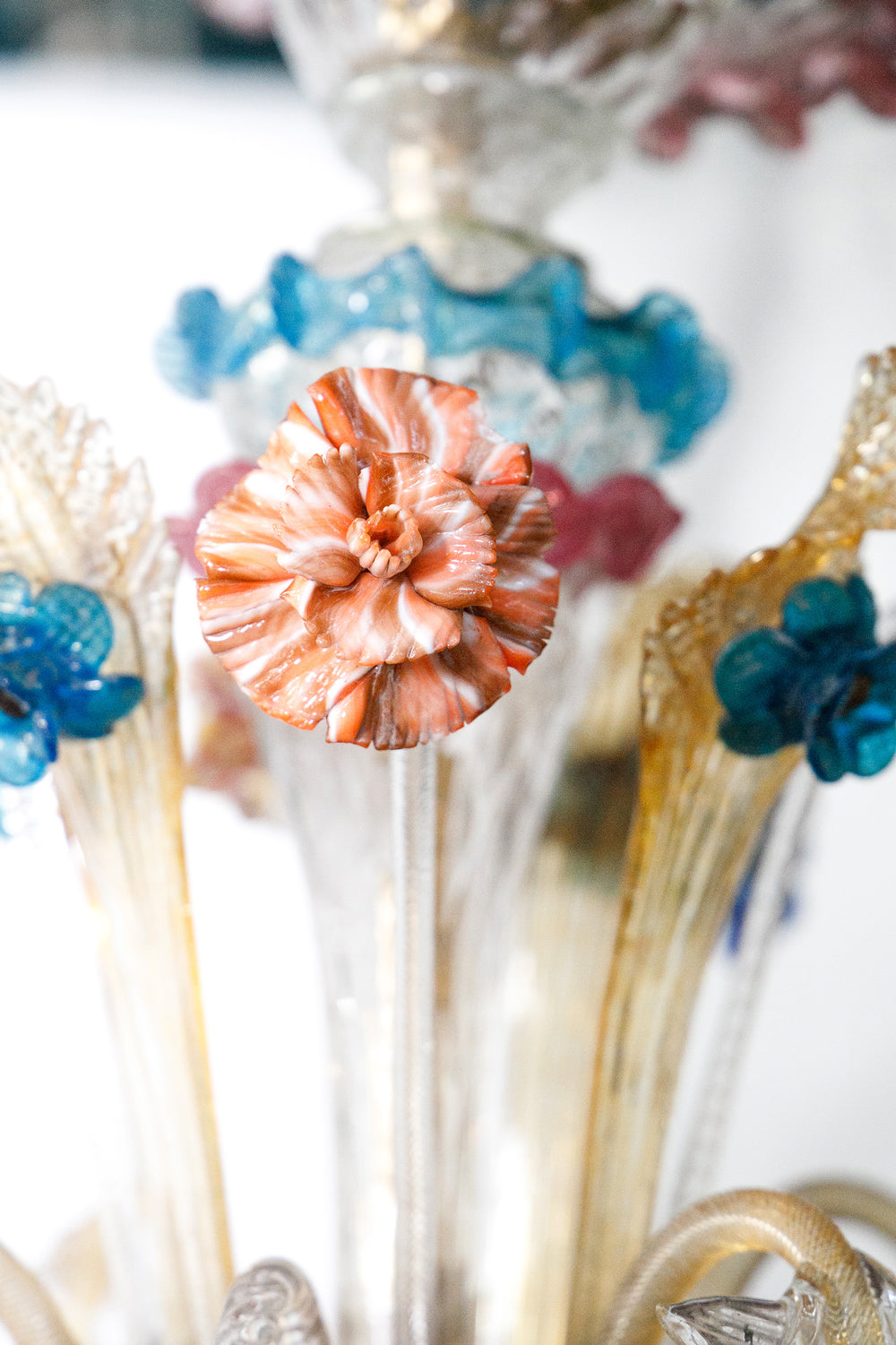 Colorful glass flower arrangement with decorative elements on a white background, part of a colorful vintage Venetian Murano Glass chandelier, available via Wildschut Antiques