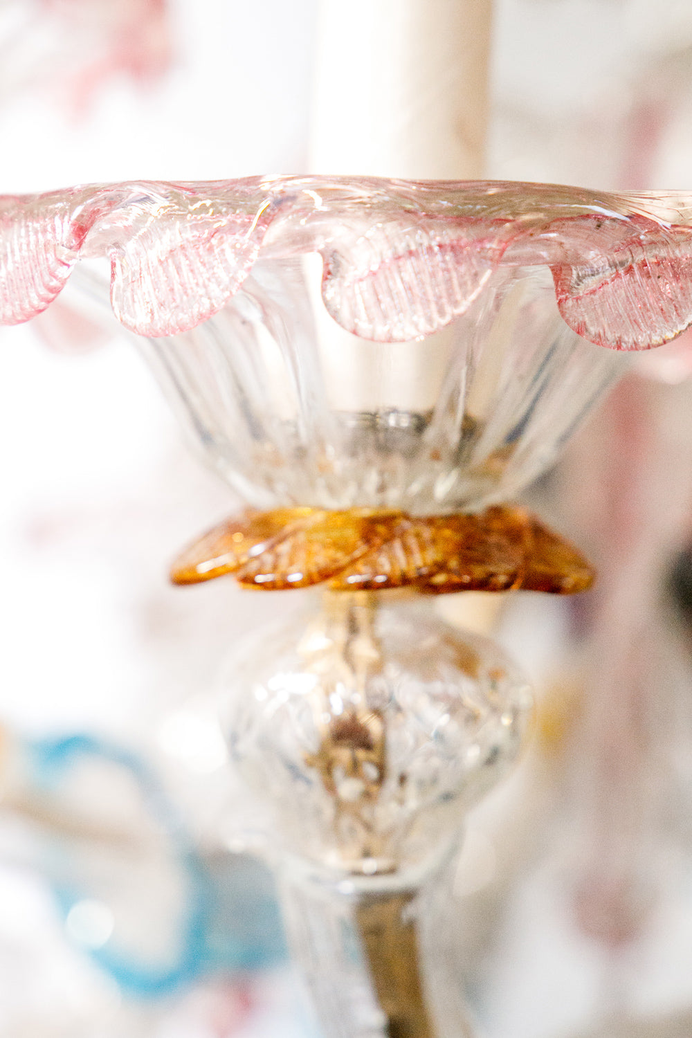 Close-up of a decorative glass object with pink and gold elements, belonging to a colorful vintage Venetian Murano Glass chandelier, available via Wildschut Antiques