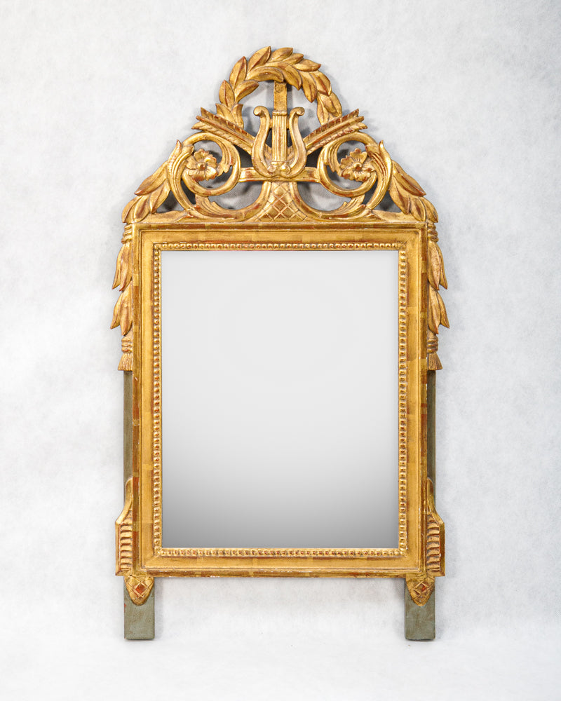 Decorative gold-framed French antique marriage mirror with a harp crest, available at Wildschut Antiques