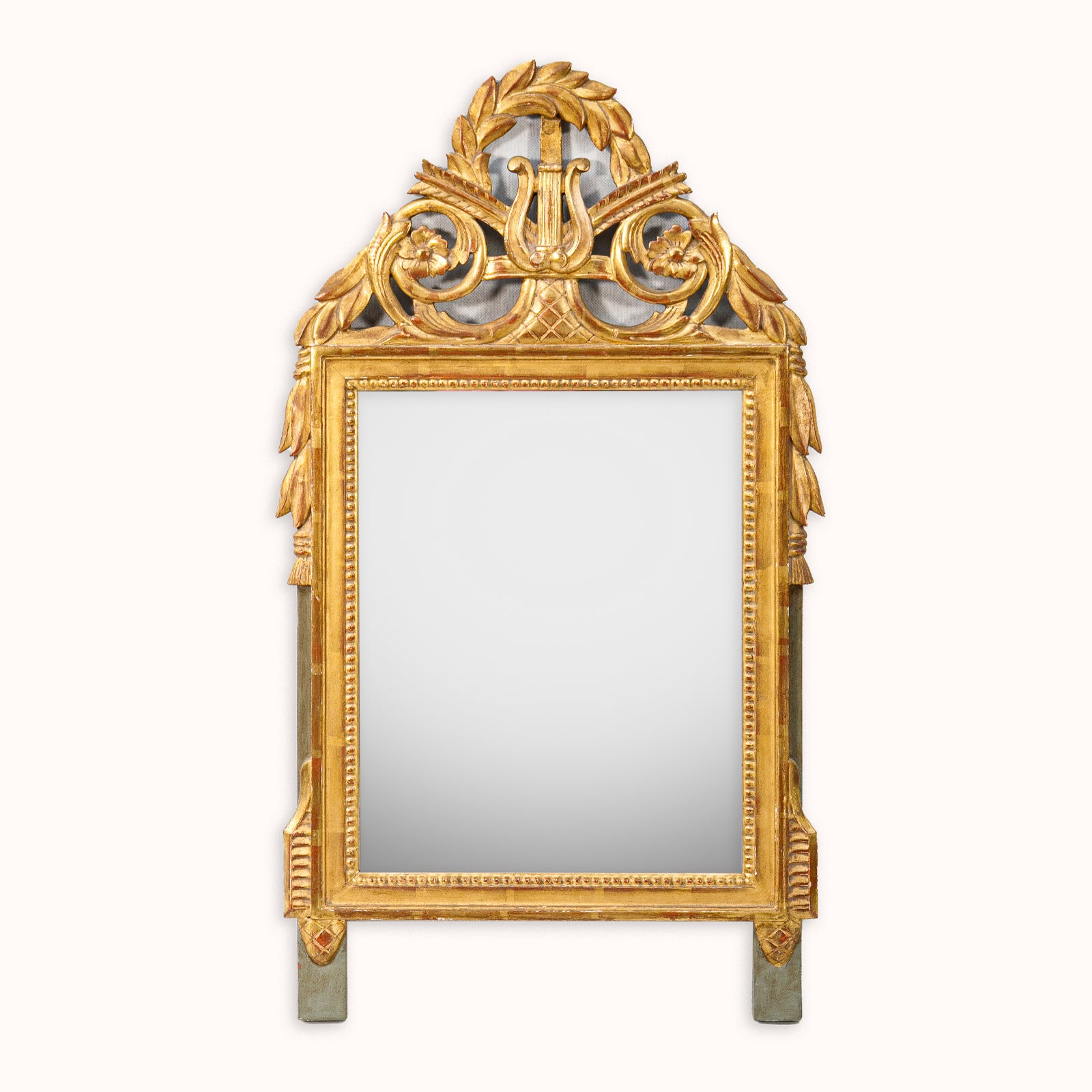 Decorative gold-framed French antique marriage mirror with a harp crest, available at Wildschut Antiques