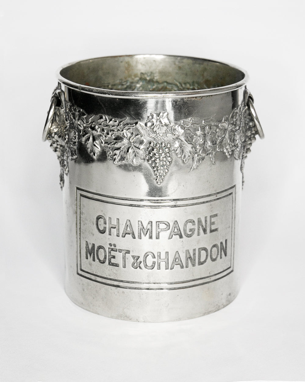 Vintage silver champagne bucket with Moét é Chandon branding on a white background
