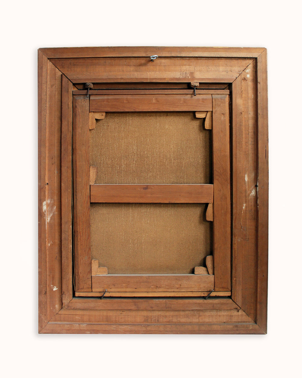 The back view of a wooden framed canvas print, showing the wooden frame, canvas backing, and hanging hardware against a light background.