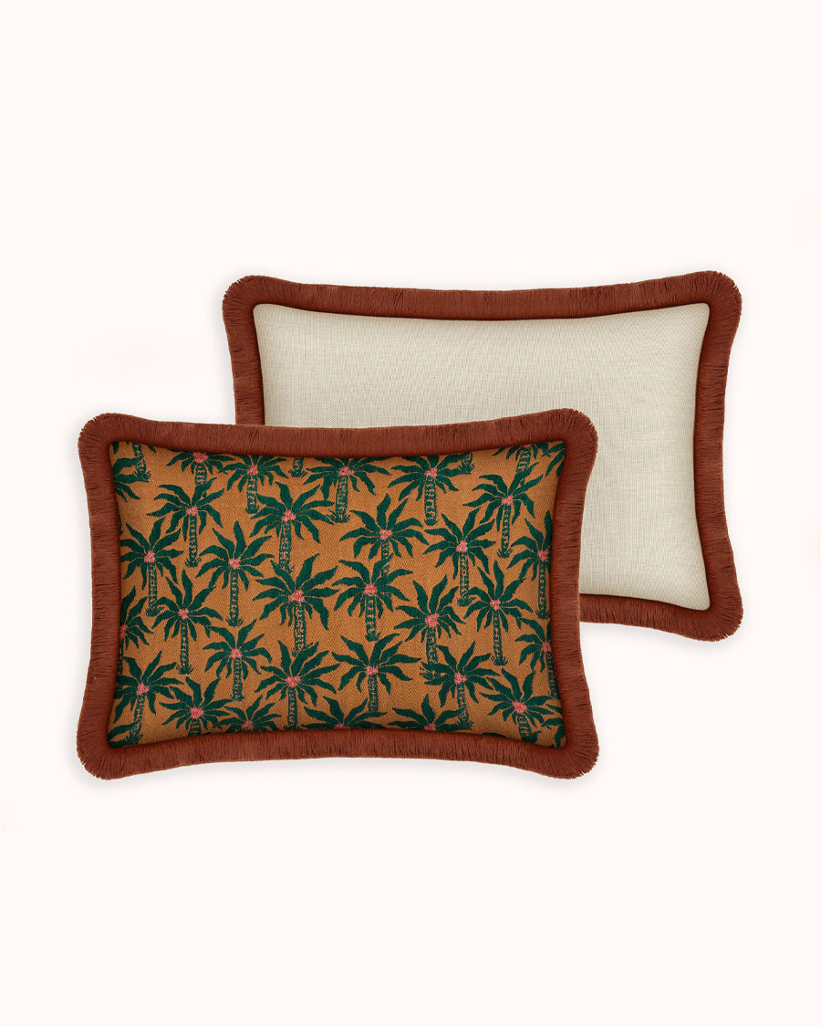 Two decorative pillows with palm tree pattern on a light background, by Dutch brand Palais available via Wildschut Antiques.