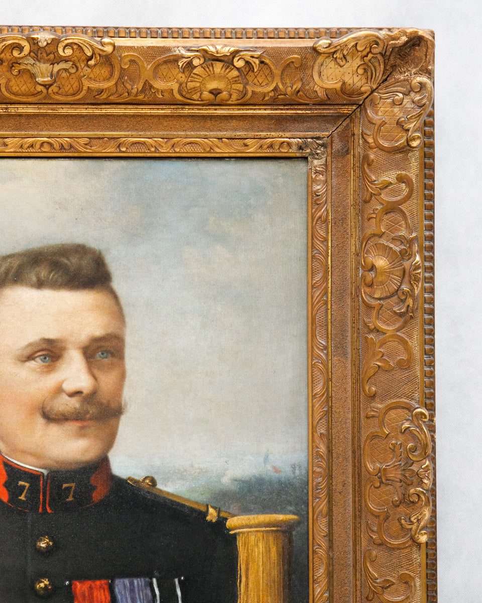 Detail of a portrait painting of a man in military uniform with an ornate gold frame