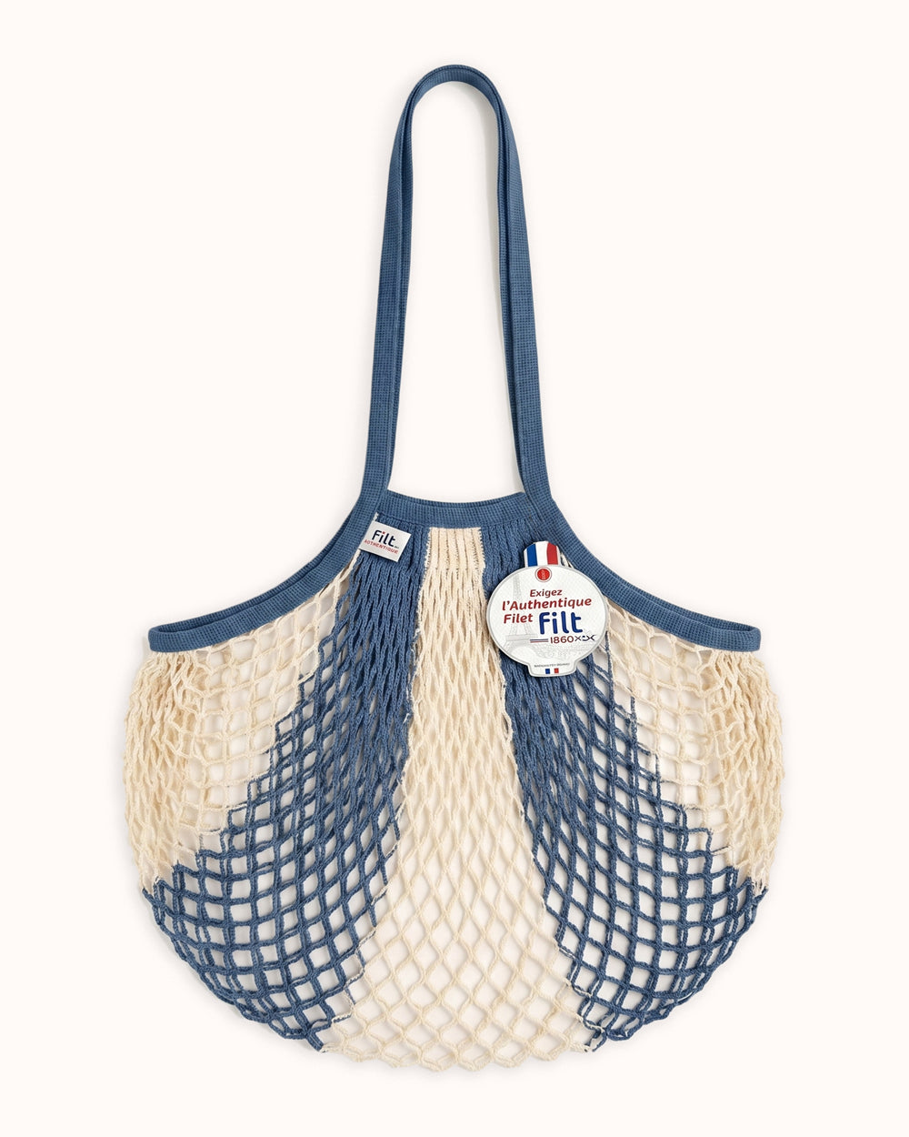 Net shopping bag with blue handles and visible brand label by Filt 1860 on a white background. Available at Wildschut Antiques.