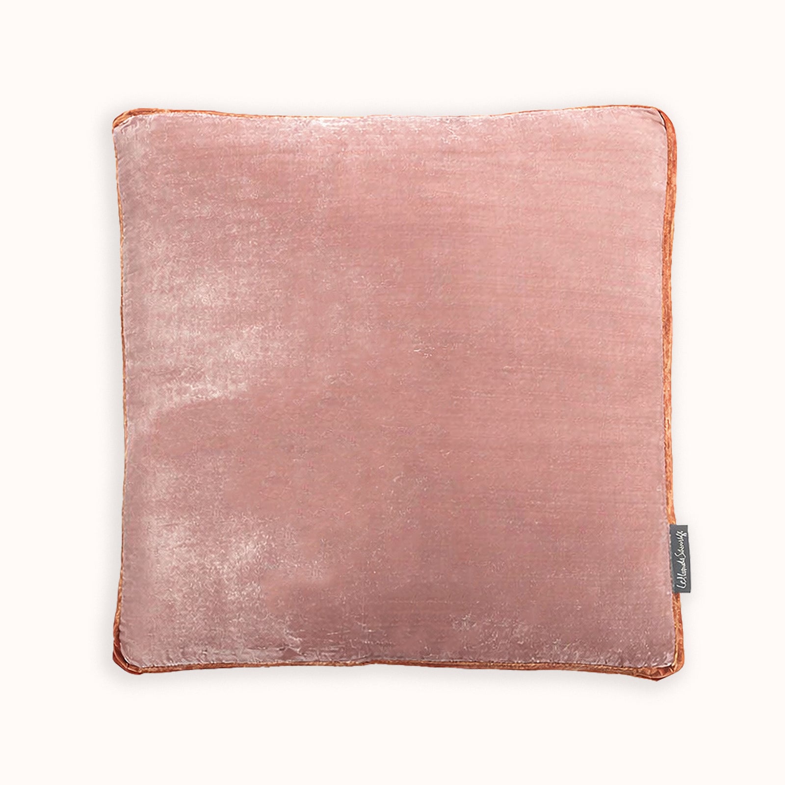Pink square cushion in silk velvet velour, on a white background. Model James, designed by Monde Sauvage Paris, available at Wildschut Antiques.
