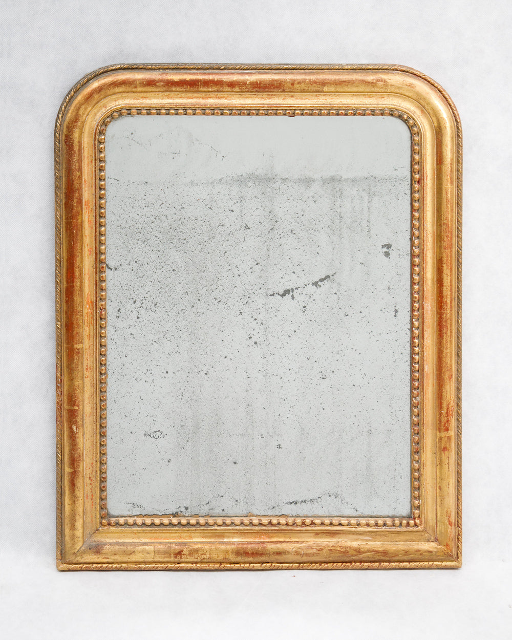 Gold-framed antique French Louis Philippe mirror with foxed glass, available via Wildschut Antiques