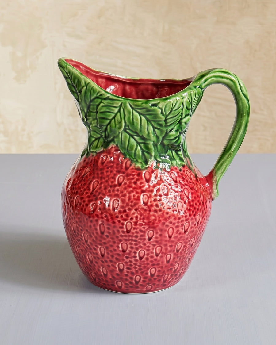 Vintage Italian ceramic strawberry-shaped pitcher, displayed on a neutral background, available at Wildschut Antiques.
